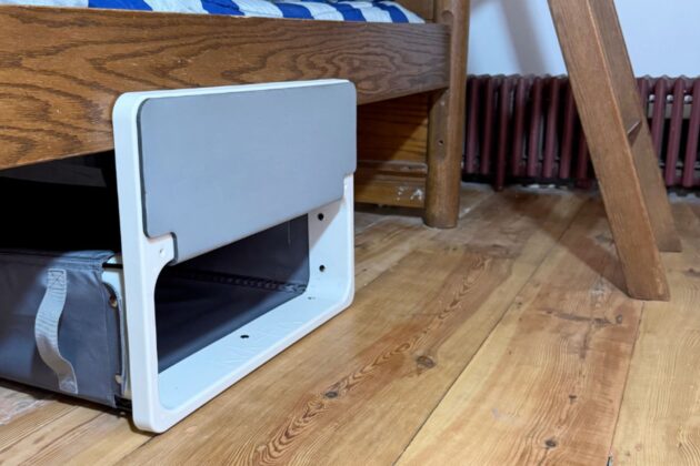 Under-bed laundry hamper uses a kick-in design to reduce clutter