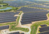 UK’s largest solar farm has more than 560,000 panels Aerial view of Cleve Hill Solar Park and its rows of photovoltaic panels in Kent, England.
