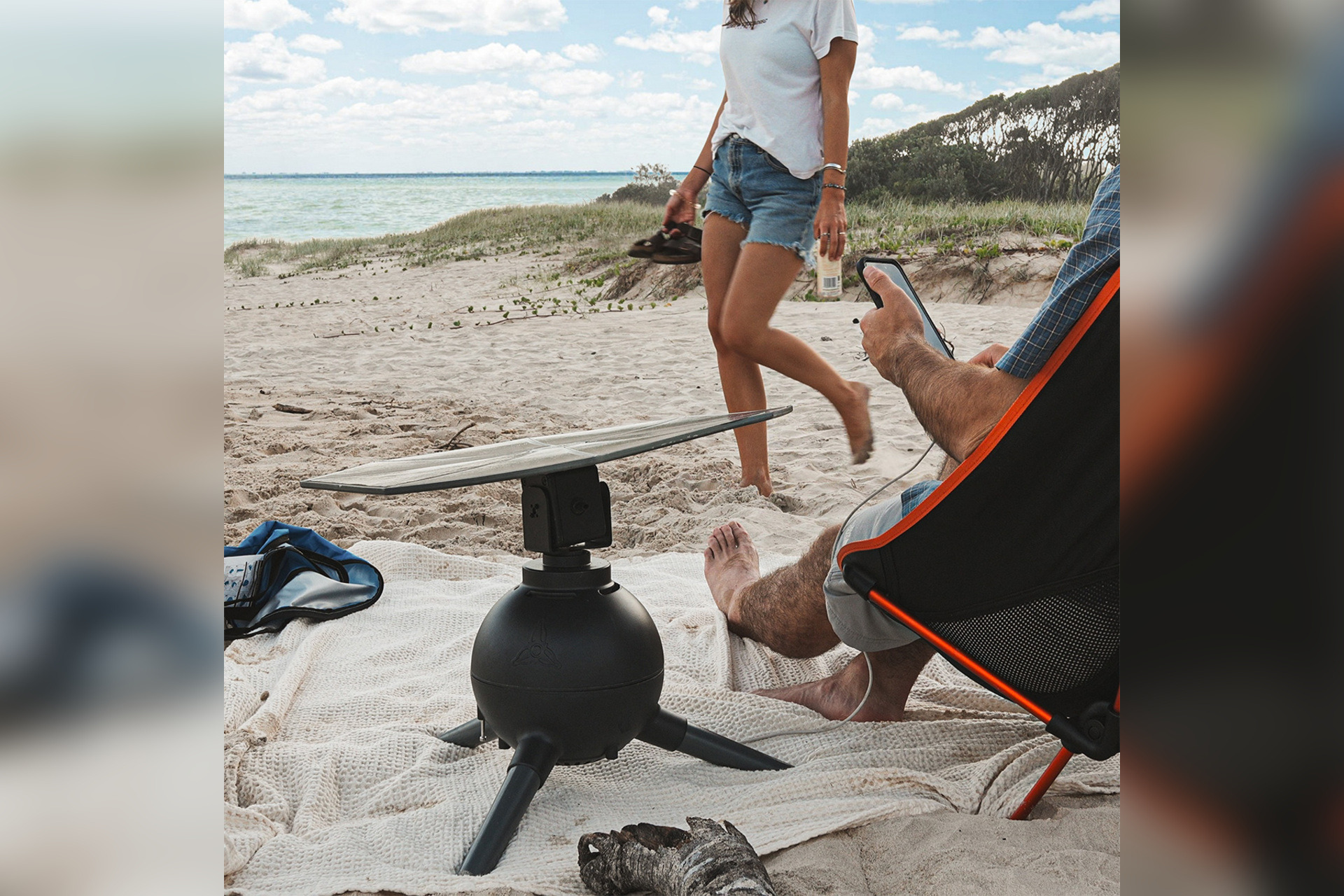 Iris T1 portable solar generator being used beside a beach campsite