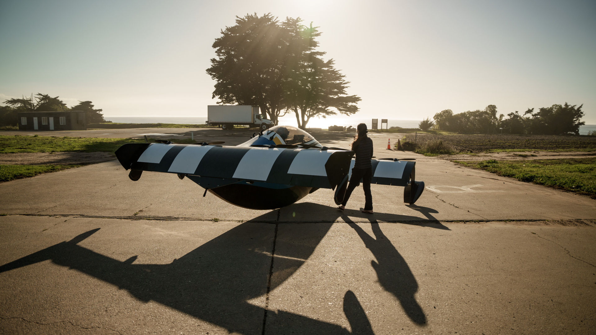 Pivotal Helix personal aircraft on the ground beside its pilot