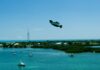 Pivotal Helix electric personal aircraft flying over coastal water