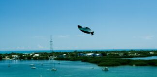 Pivotal Helix electric personal aircraft flying over coastal water