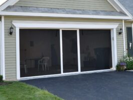 Retractable screen turns an open garage into a bug-free living space ScreensLux Lifestyle Garage Screen Featured