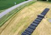 Aerial view of photovoltaic panels unfolding from the SolarCont Solarcontainer
