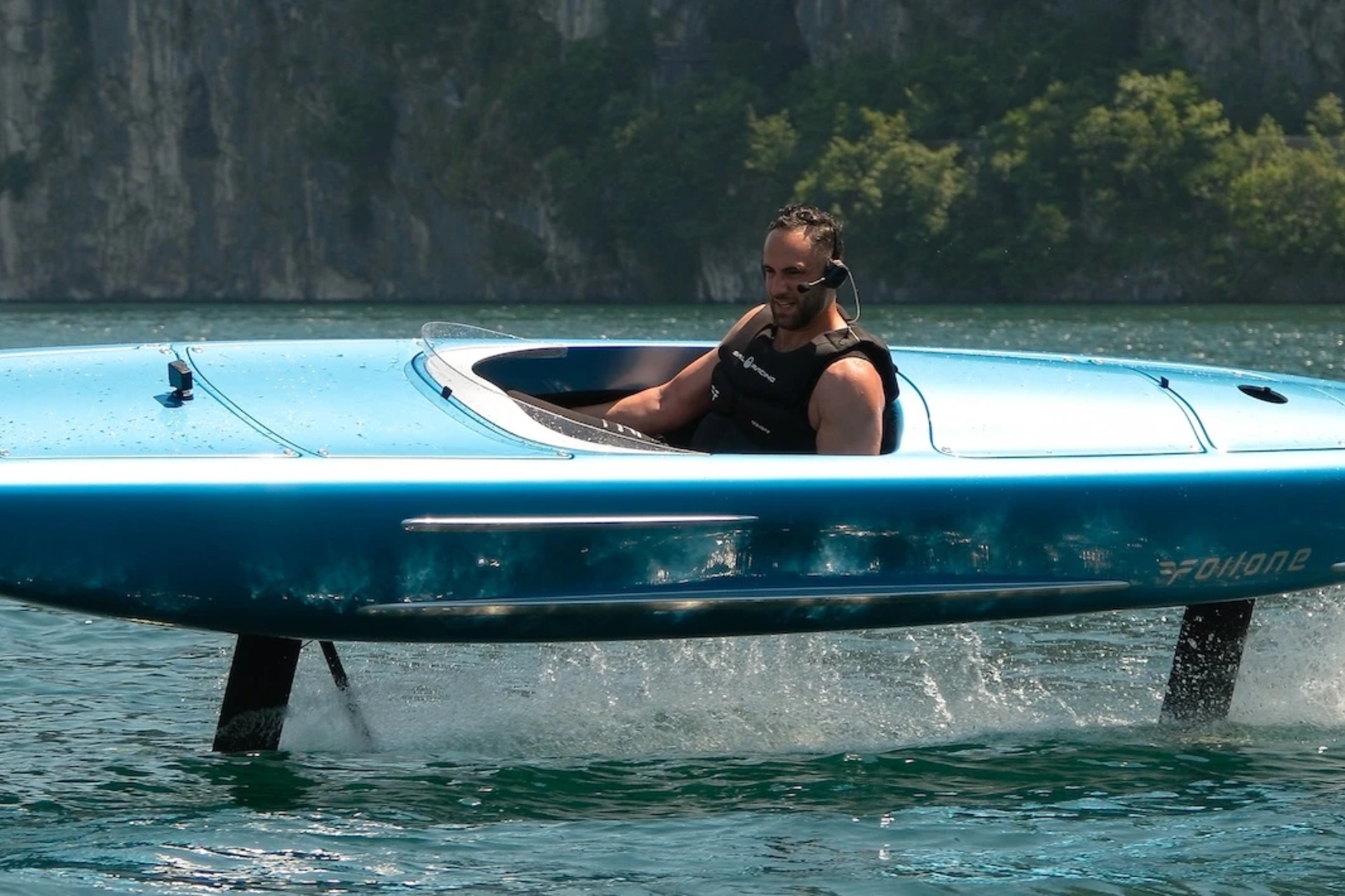 Blue Foilone Pegasus electric hydrofoil in flight with its front and rear struts visible