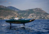 Green Foilone Pegasus electric hydrofoil flying above Lake Como