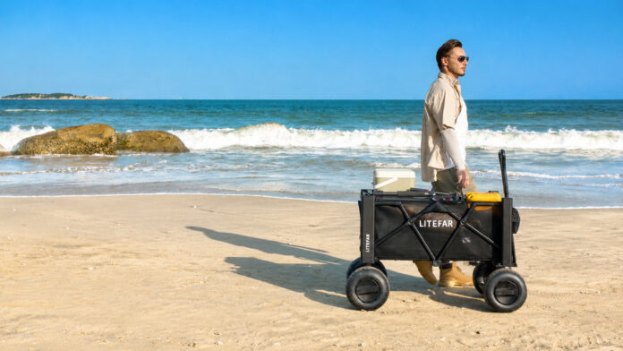 LITEFAR B1 electric beach wagon carrying outdoor gear across soft sand