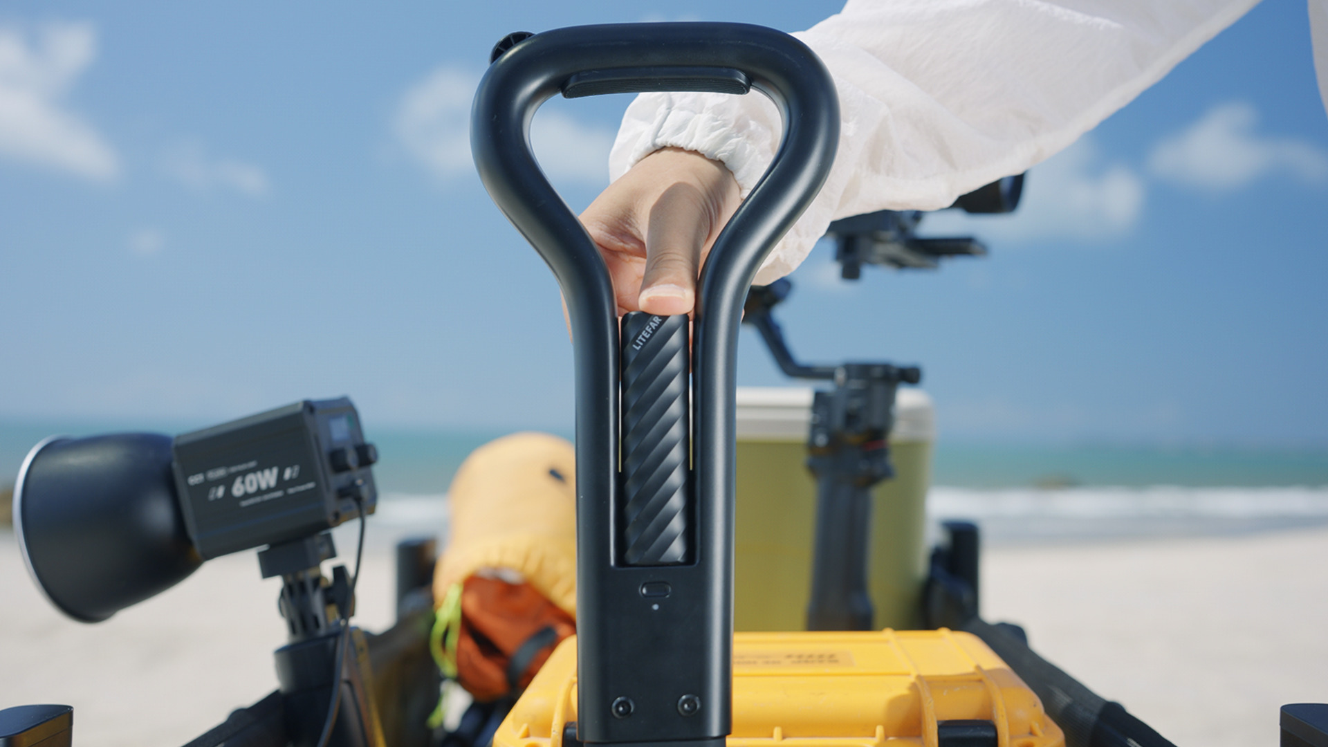 Person controlling the LITEFAR B1 electric wagon through its smart handle