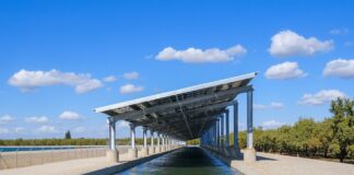 Solar panels installed above a Turlock Irrigation District canal as part of California's Project Nexus pilot