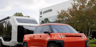 Telo MT1 compact electric pickup towing a Pebble Flow travel trailer