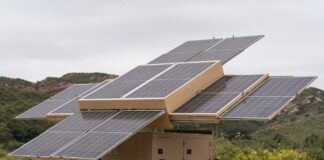 Fully deployed 123eSolar 123-STG-4 trailer with ten solar panels extended in multiple directions
