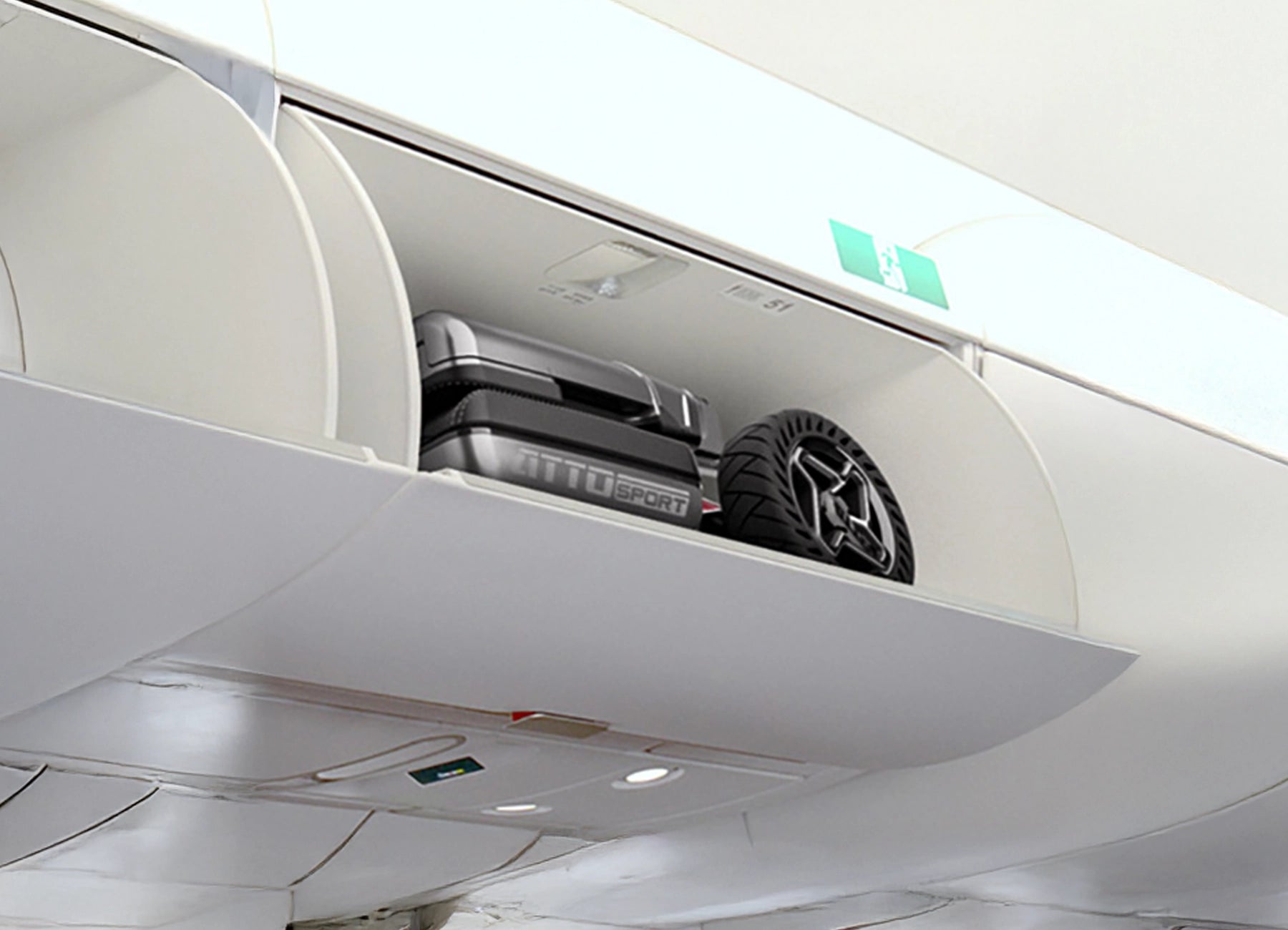 Folded ATTO Sport mobility scooter stored in an aircraft overhead compartment