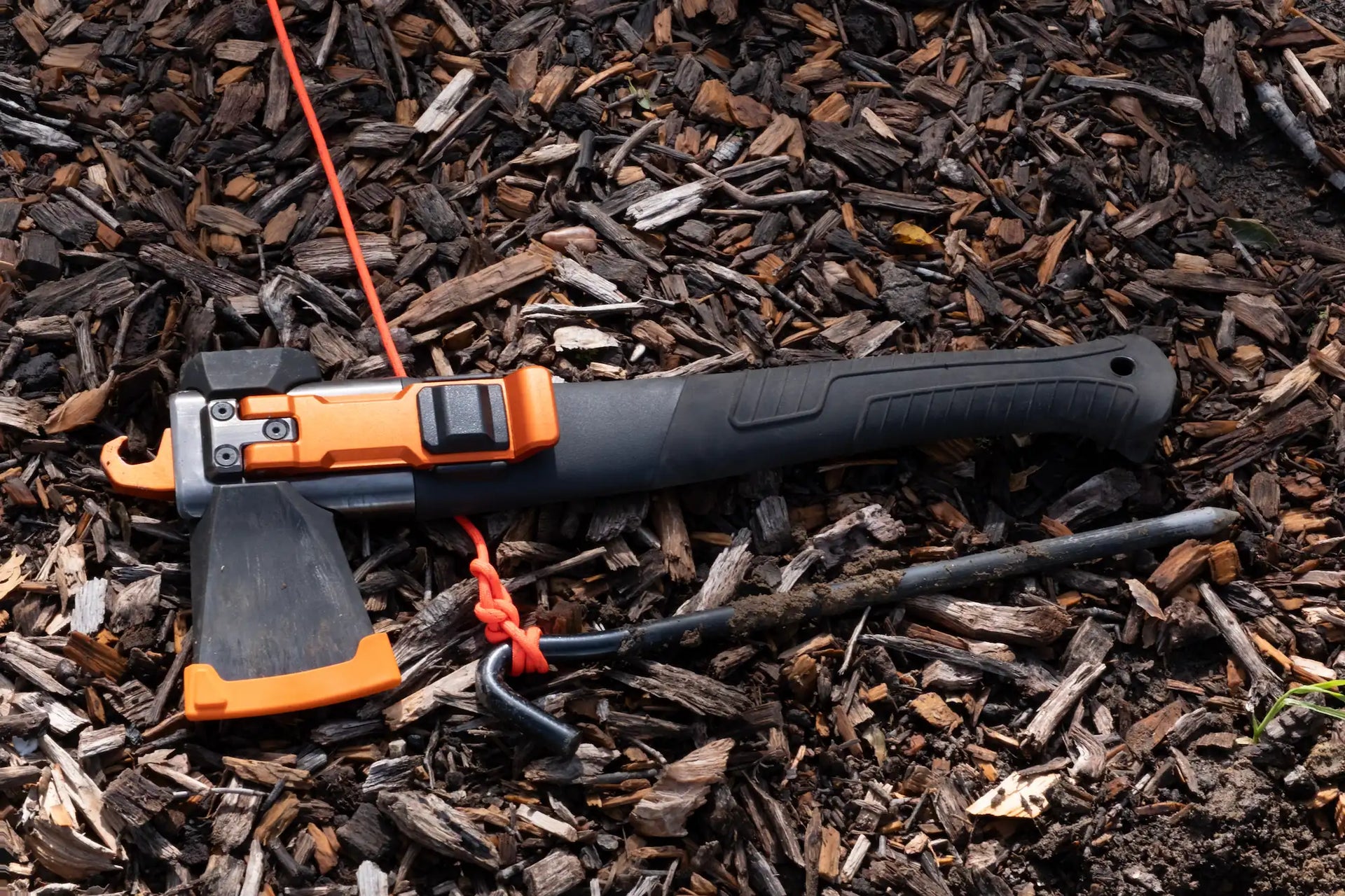 Adventure Mate AM-V3 axe resting on the ground at a campsite
