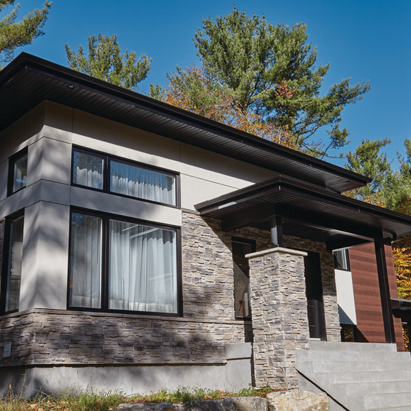 Contemporary house exterior accented with dark Be.On Stone Canyon veneer