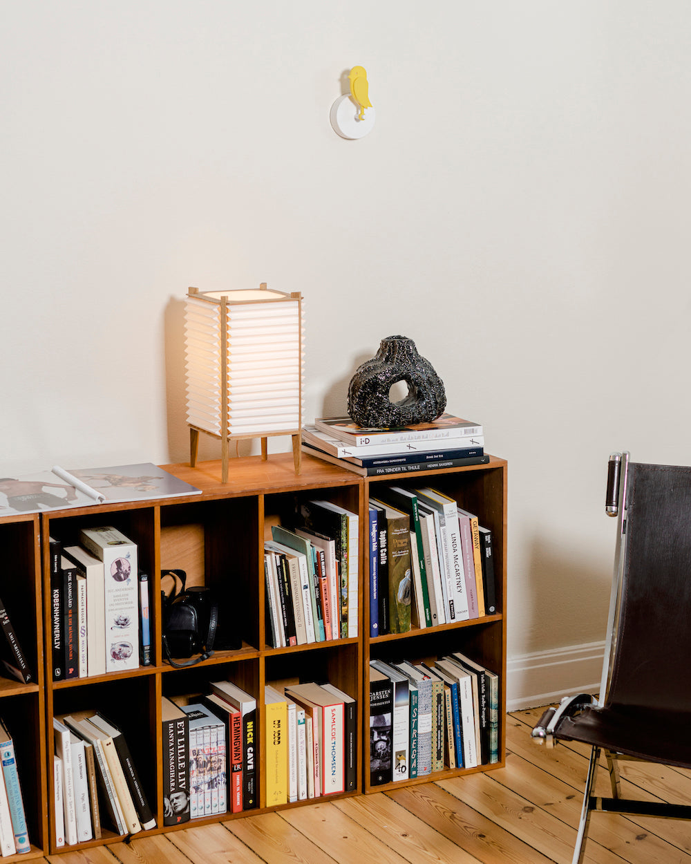 Birdie 2.0 CO2 monitor mounted high on a living-room wall