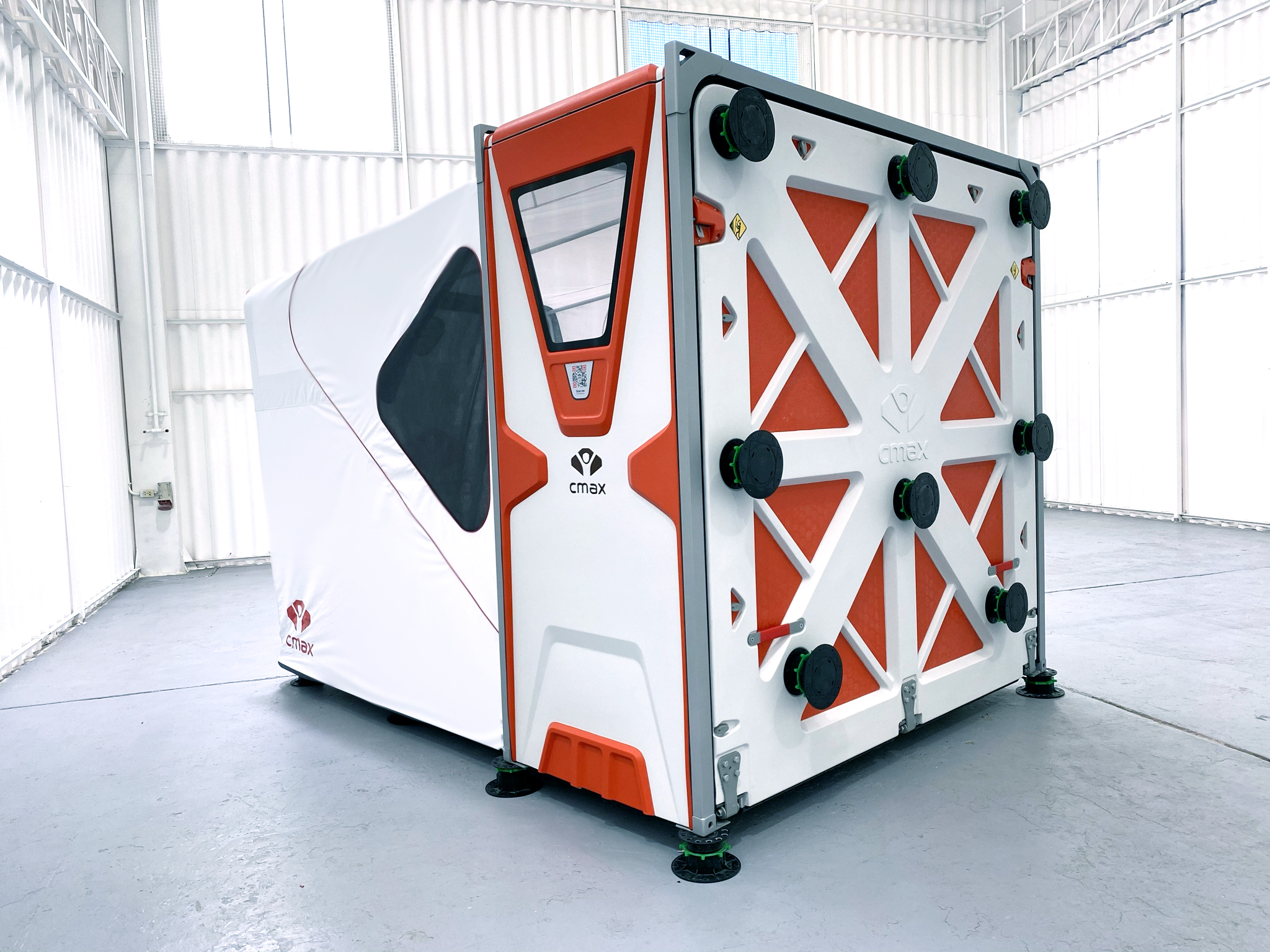 Compact folded CMAX CX20 standing on adjustable feet inside a warehouse