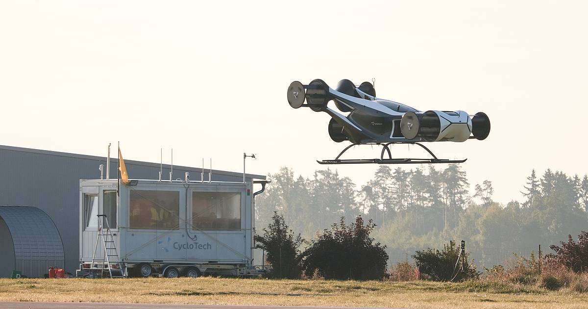 BlackBird CycloRotor demonstrator hovering above a field beside a mobile flight-control station