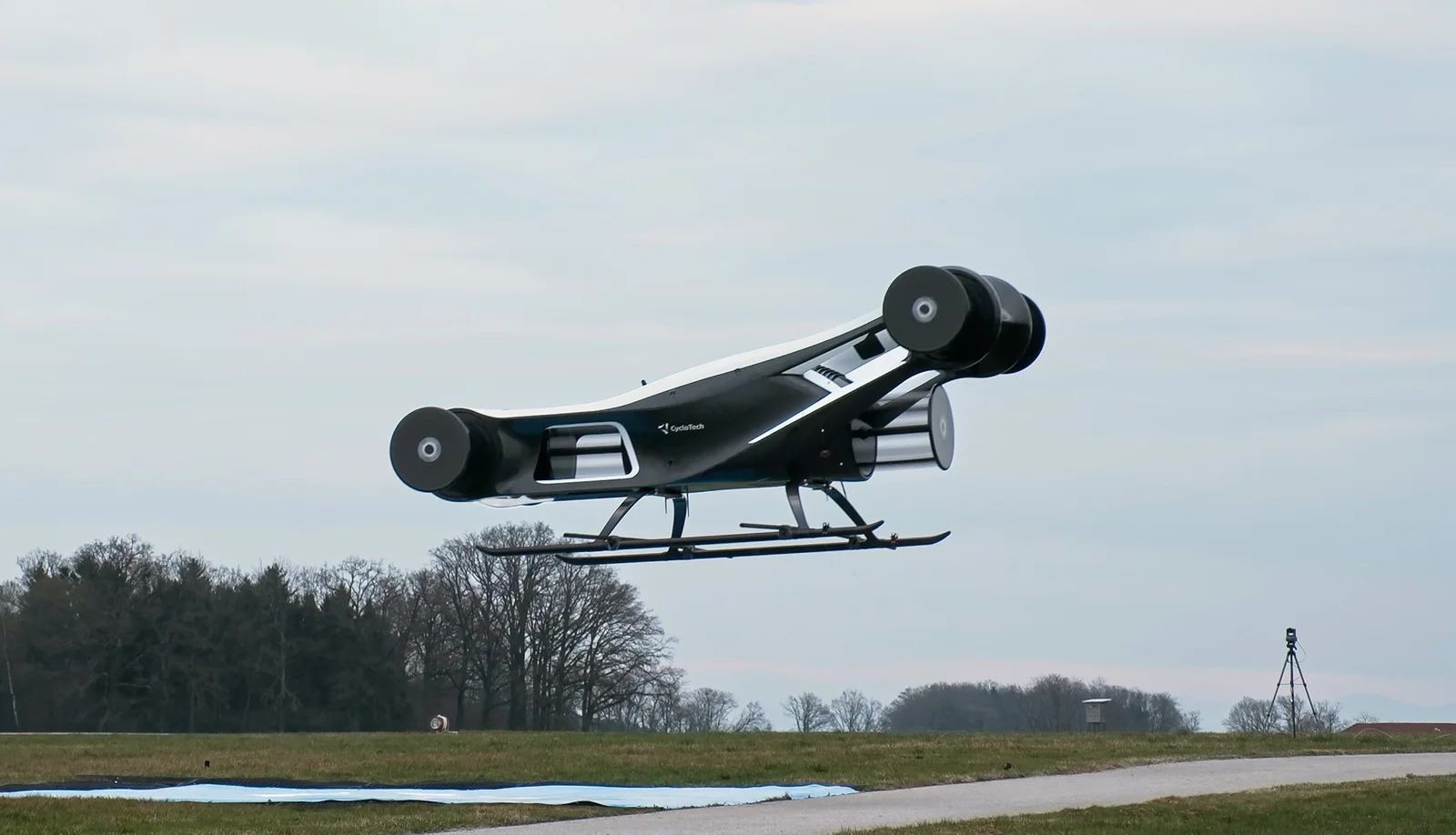 Side view of the BlackBird experimental eVTOL hovering level during an outdoor flight test