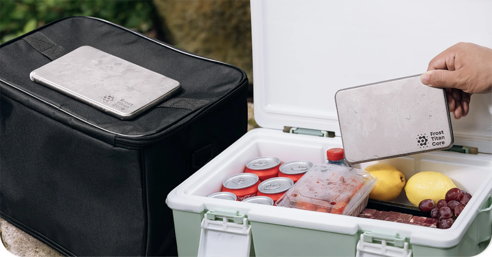 Frost Titan Core cooling plate shown on a soft cooler and being placed inside a hard cooler containing food and canned drinks