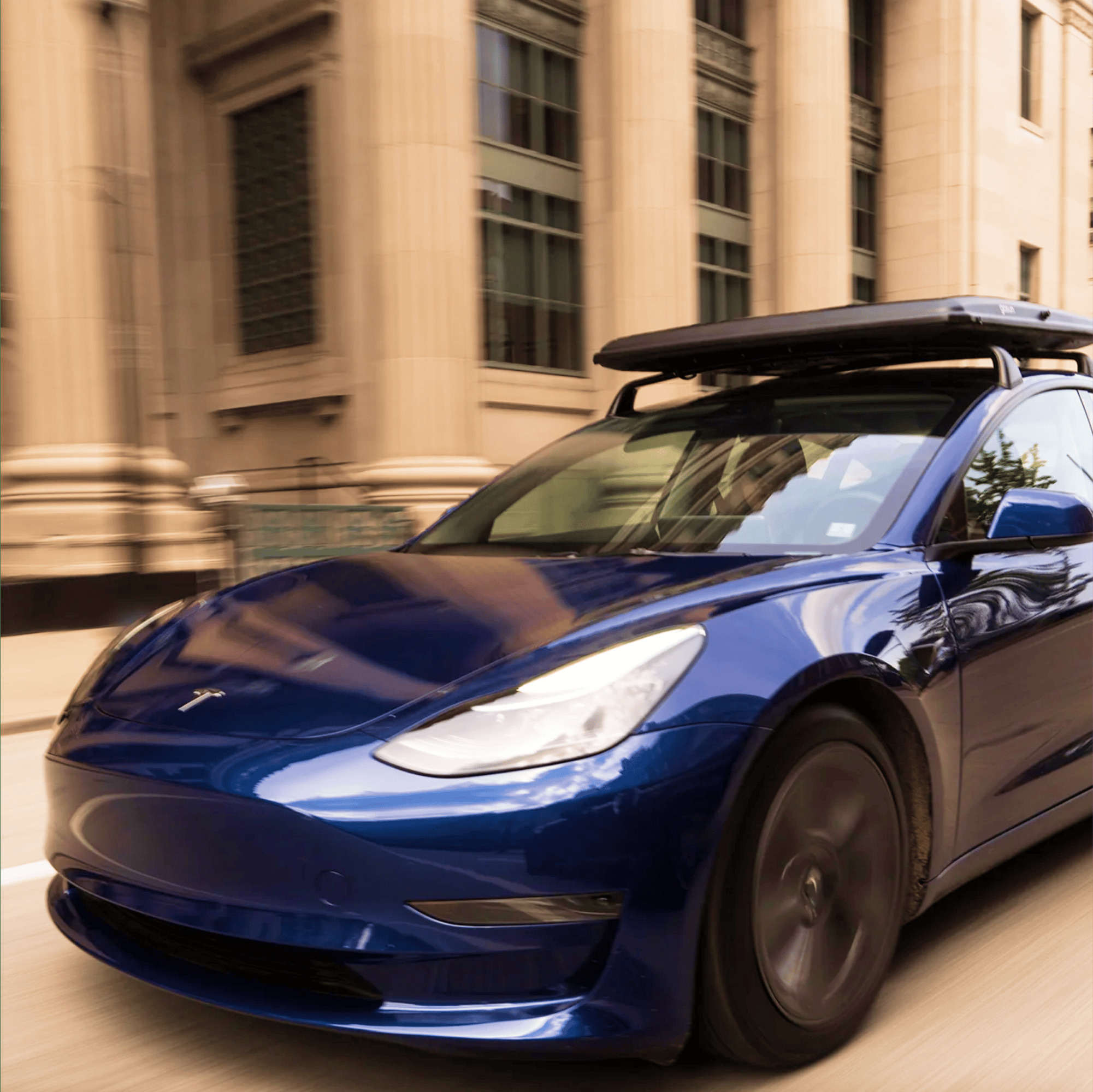 GoSun EV Solar Charger folded into its rooftop case on a moving electric car