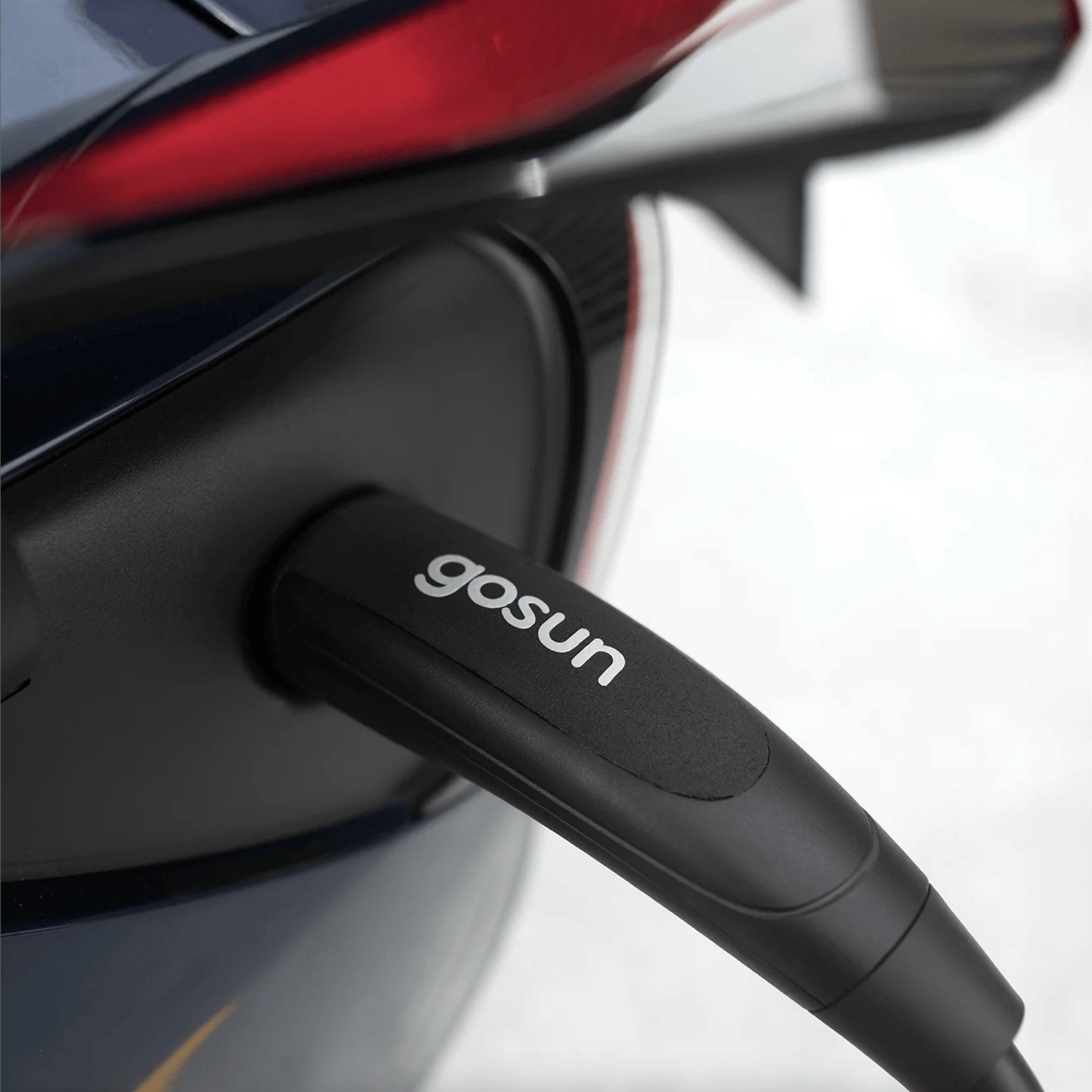 Close-up of a Level 1 charging connector plugged into an electric vehicle using GoSun solar power