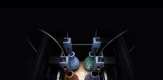 Four LightMake L4 print heads producing four colored lattice objects on one build plate