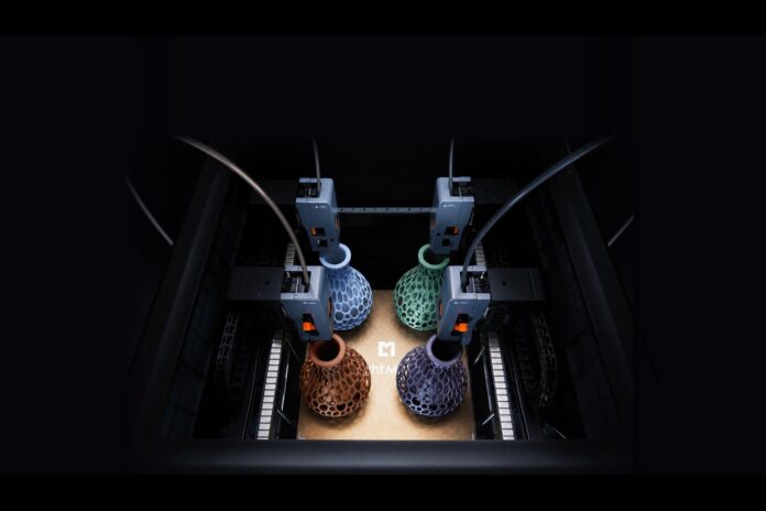 Four LightMake L4 print heads producing four colored lattice objects on one build plate
