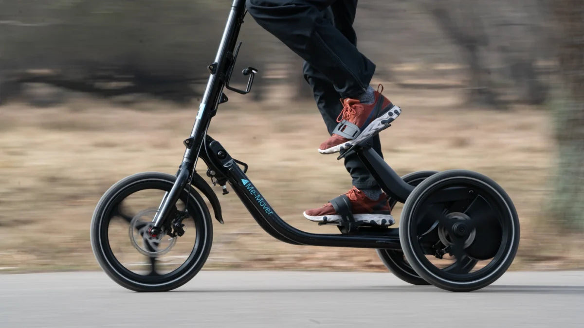 Side view of a rider stepping on a black Me-Mover Speed Ultra