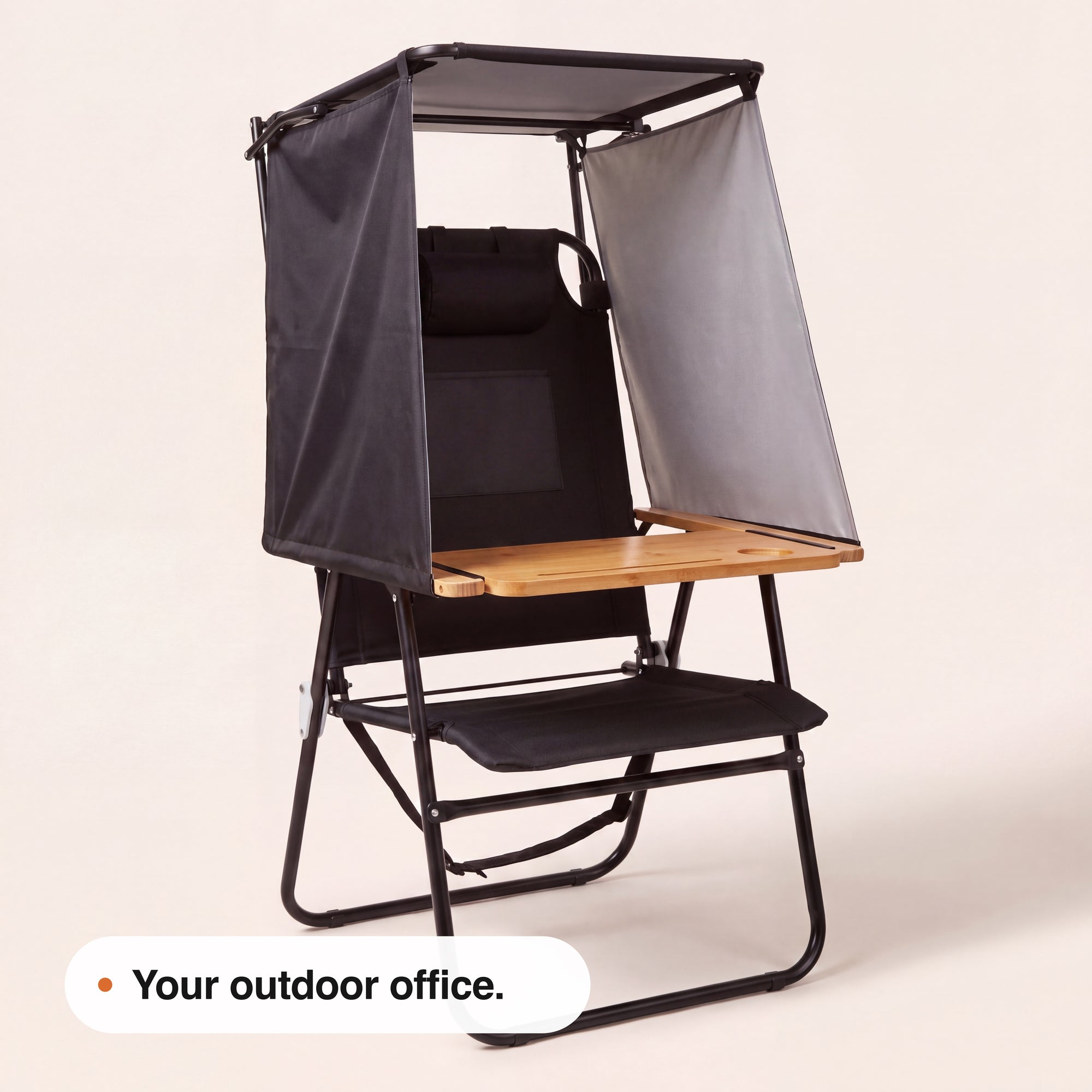 Front view of the unfolded NomaPod chair, desk and canopy structure