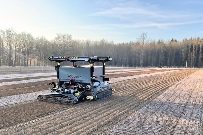 Roboton Farmer tracked agricultural robot preparing rows in a vegetable field