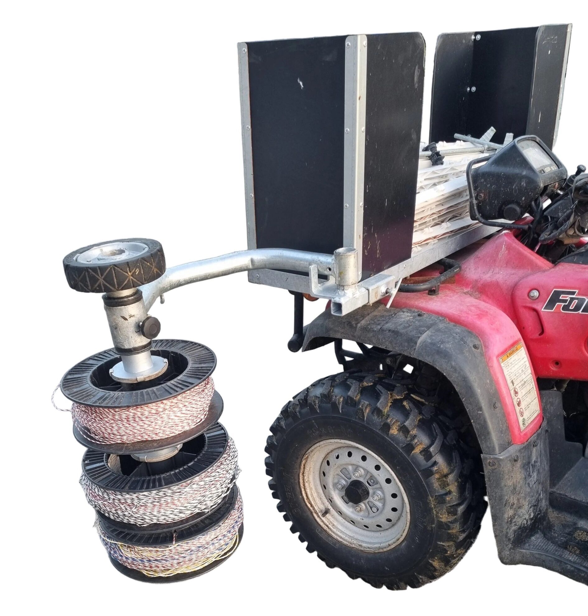 Close-up of three fence-wire reels and individual clutches on the Sheep School ATV system