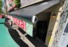 Retractable SolarMarkise photovoltaic awnings shading outdoor restaurant seating in Cologne