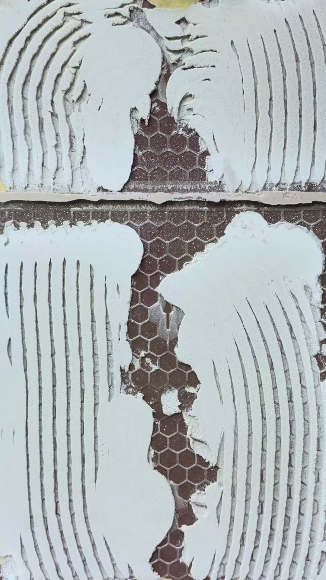 StoneScience tool injecting adhesive through a small hole in flooring