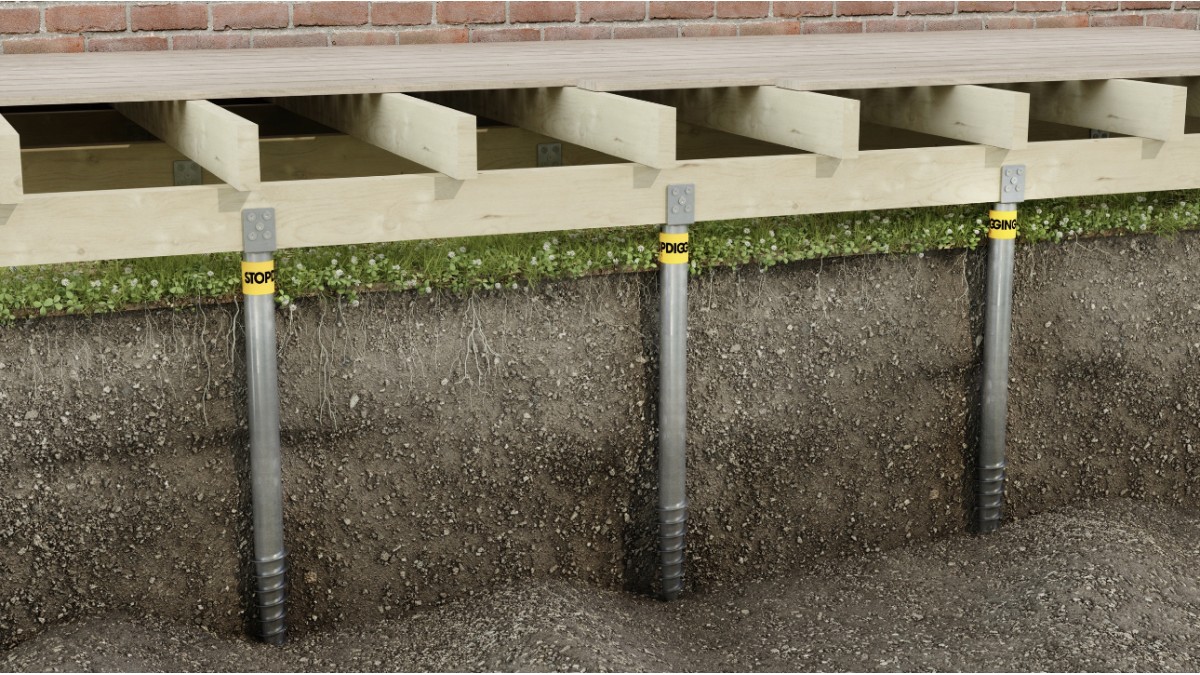 Cutaway view of three galvanized ground screws supporting a timber deck frame