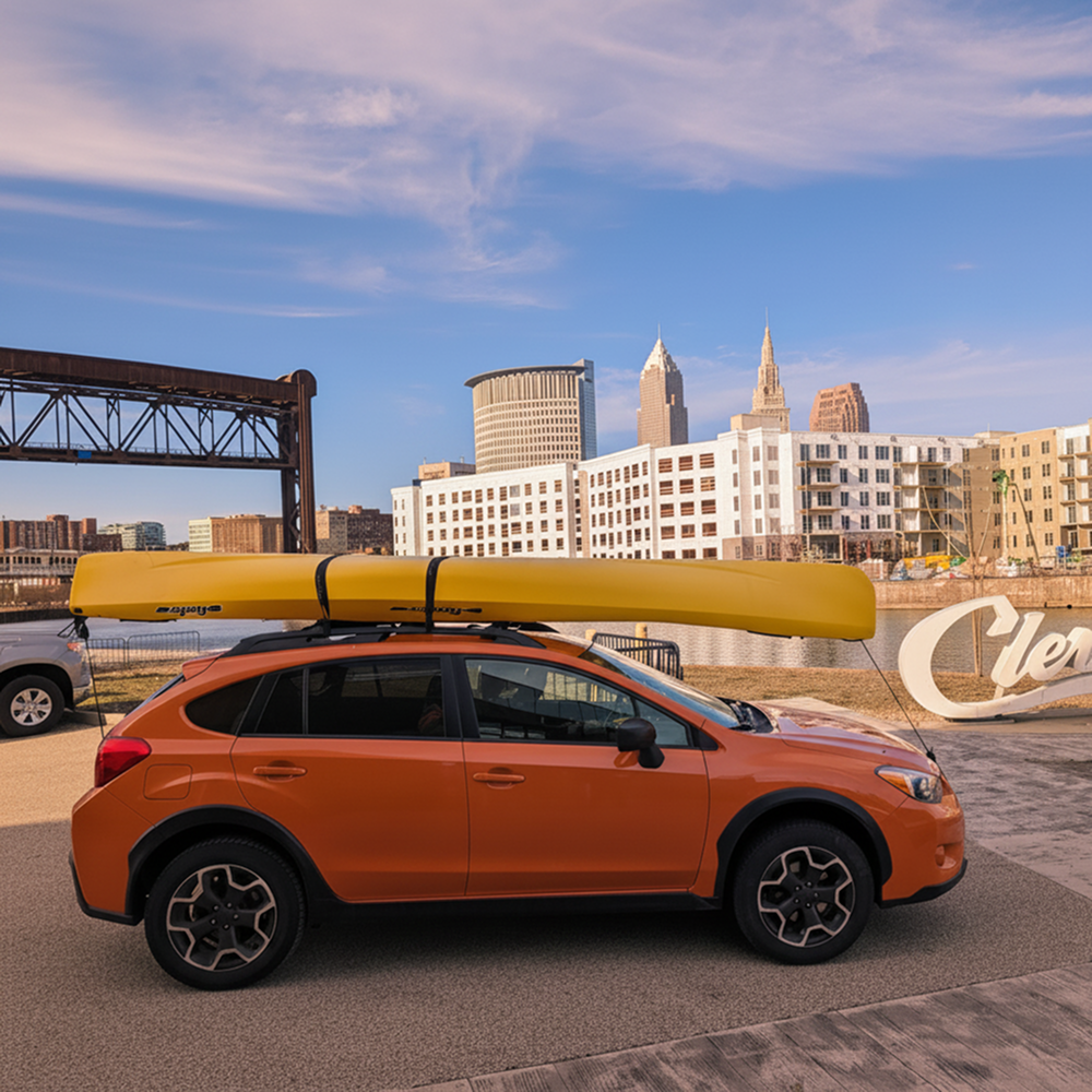 A sunset-colored RowYak carried on a vehicle roof rack