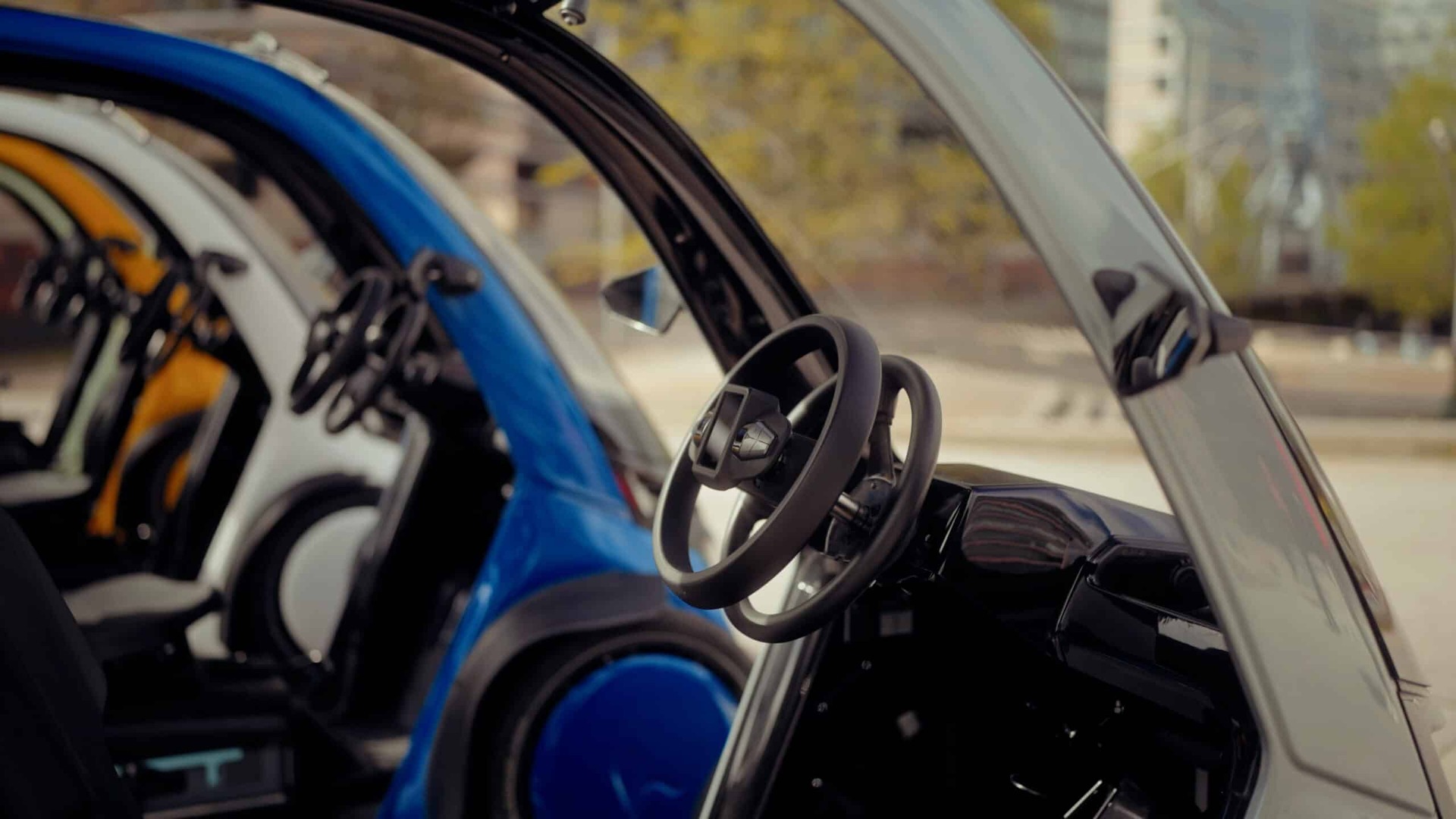Steering wheels and dashboards inside several Hopper Mobility electric cargo bikes
