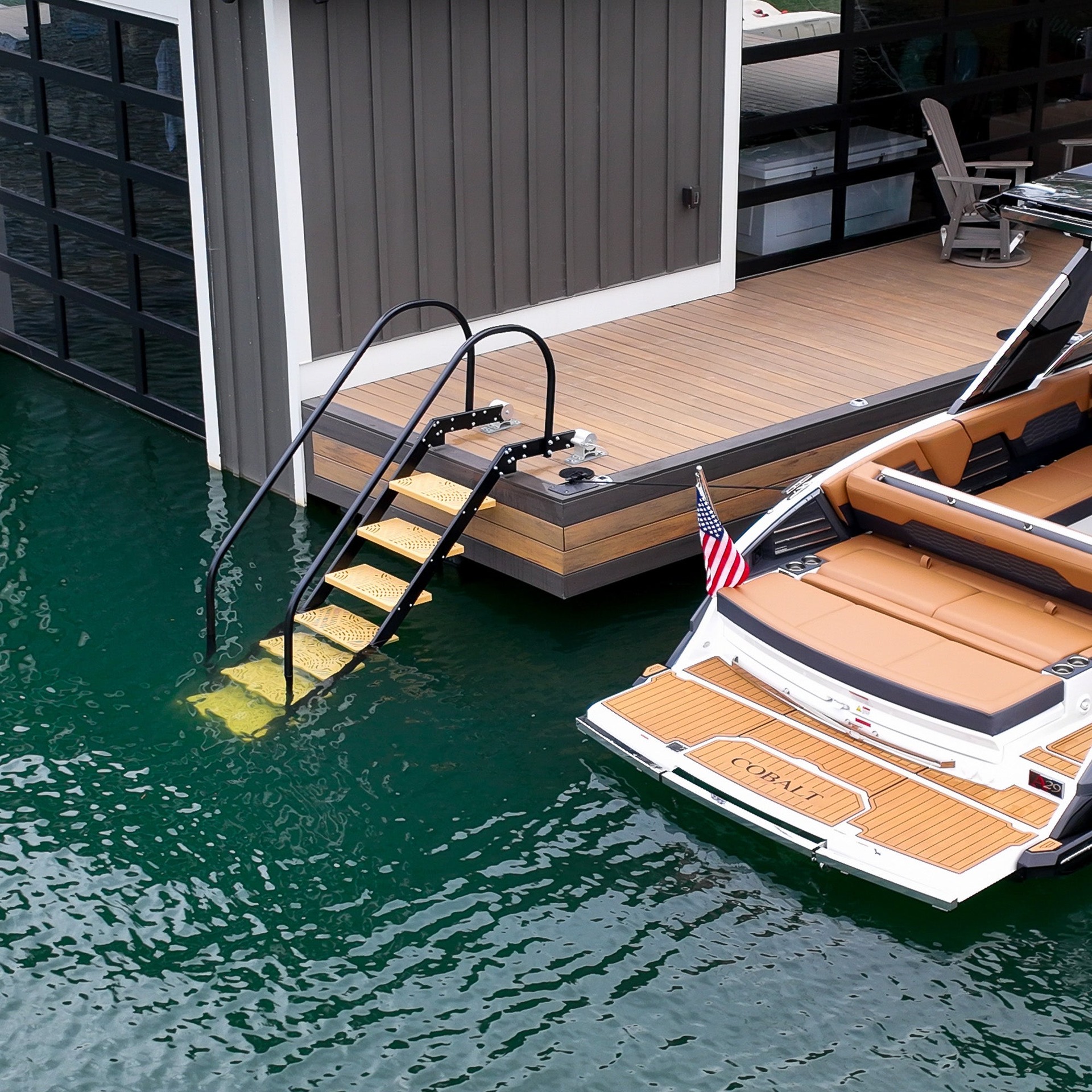 NautiSteps ladder installed beside a boat dock with two curved handrails